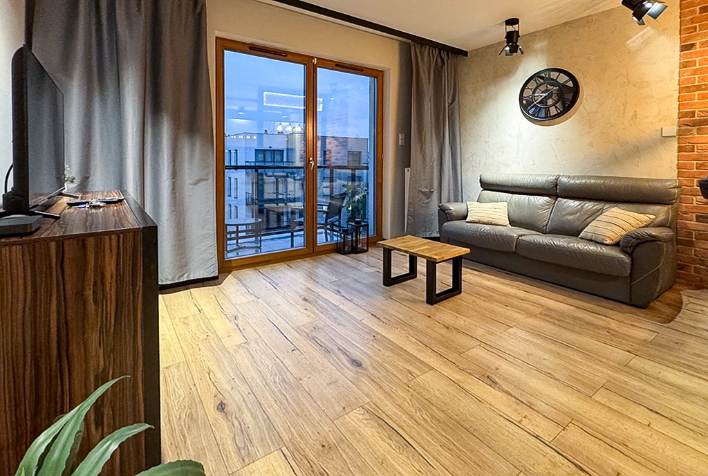 druga strona pokoju dziennego w luksusowym apartamencie na sprzedaż Gdańsk