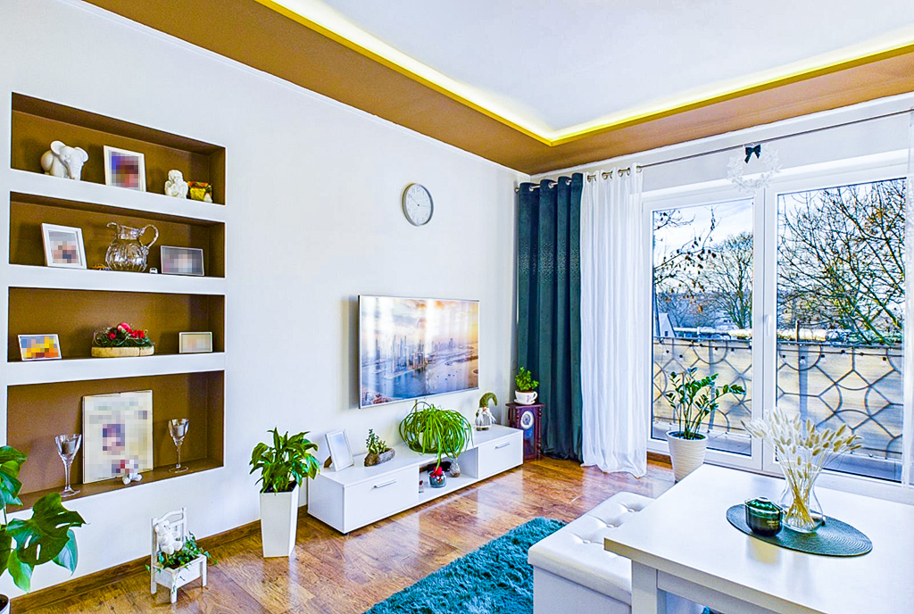 inna perspektywa pokoju gościnnego w luksusowym apartamencie na sprzedaż Ostrów Wielkopolski