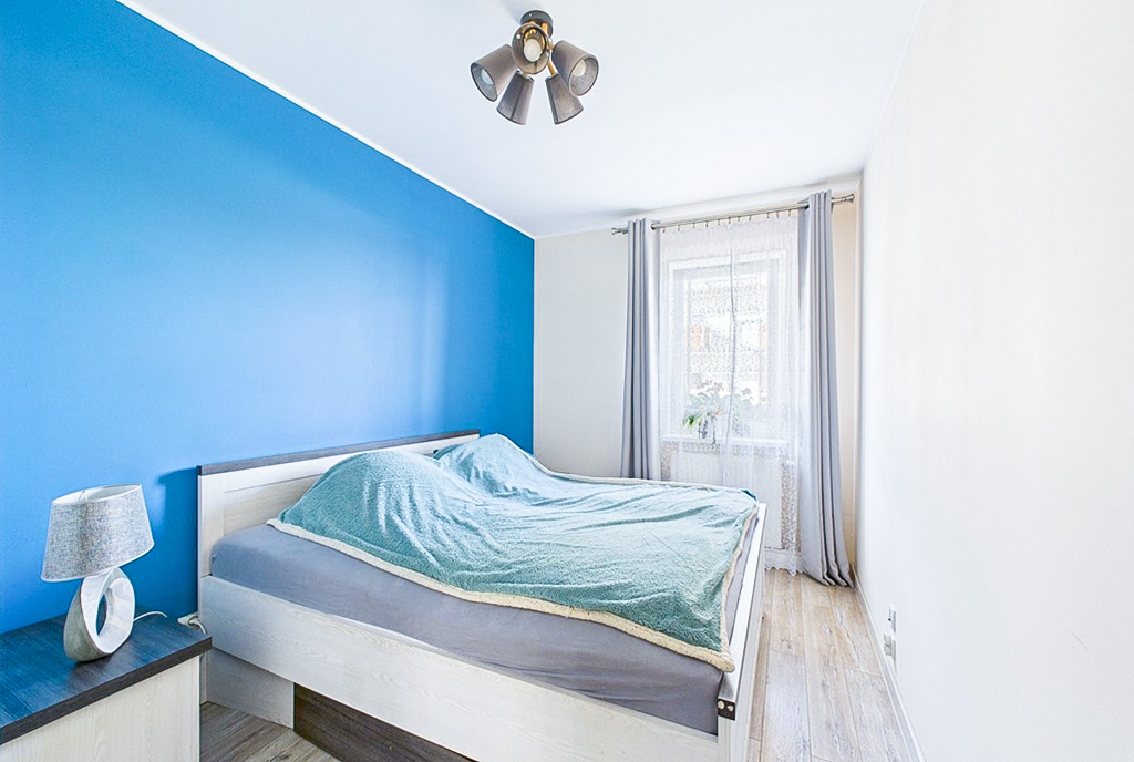 zaciszna sypialnia w ekskluzywnym apartamencie na sprzedaż Poznań (okolice)