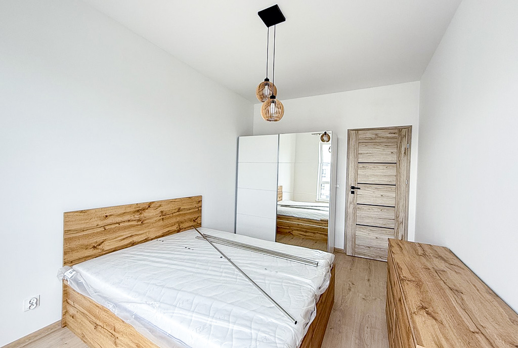 na zdjęciu sypialnia w ekskluzywnym apartamencie na wynajem Suwałki