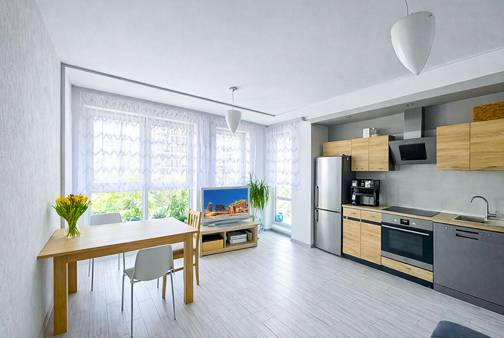 po lewej salon, po prawej kuchnia w ekskluzywnym apartamencie do sprzedaży Białystok