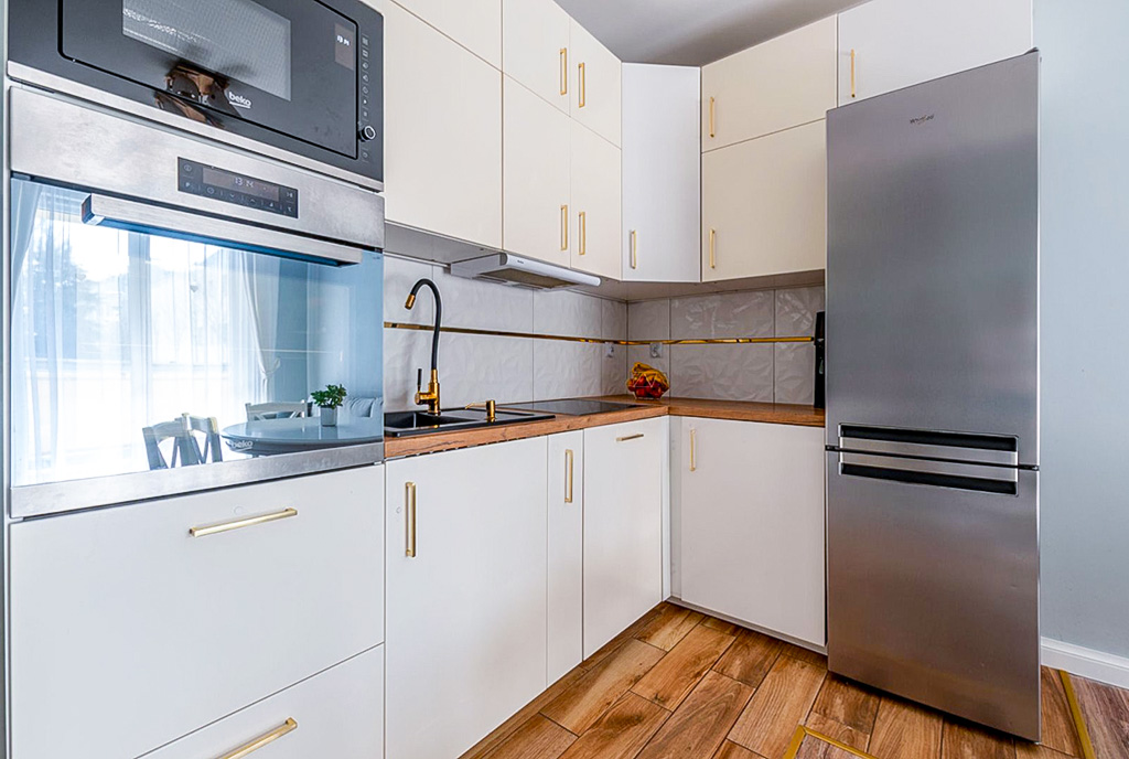 zbliżenie na kuchnię w ekskluzywnym apartamencie na sprzedaż Elbląg