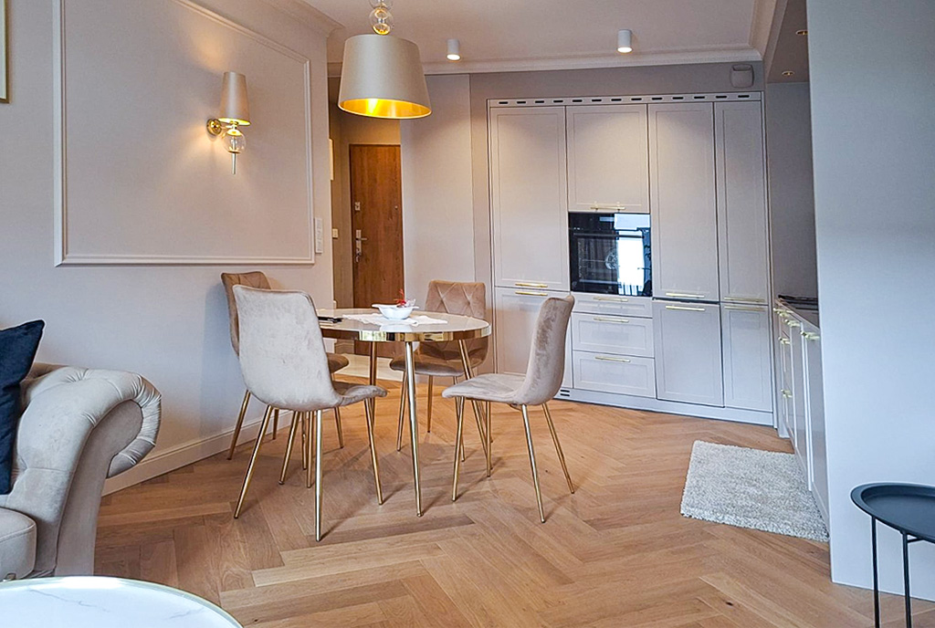 zbliżenie na kuchnię i jadalnię w luksusowym apartamencie do wynajmu Katowice