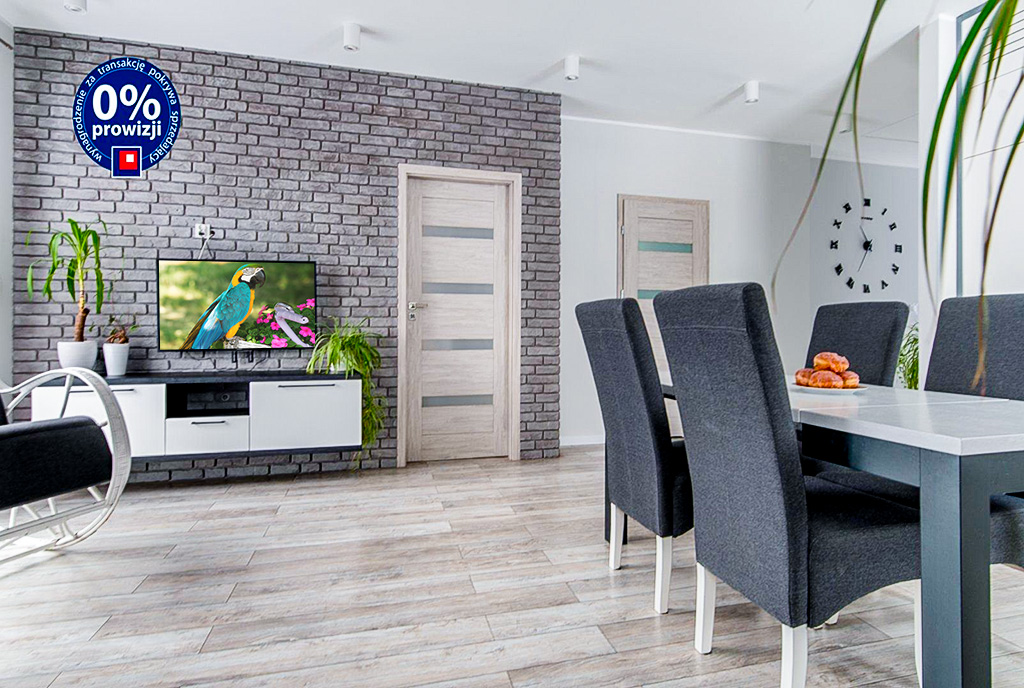 Po lewej salon po prawej jadalnia w luksusowym apartamencie na sprzedaż Gdynia okolice.
