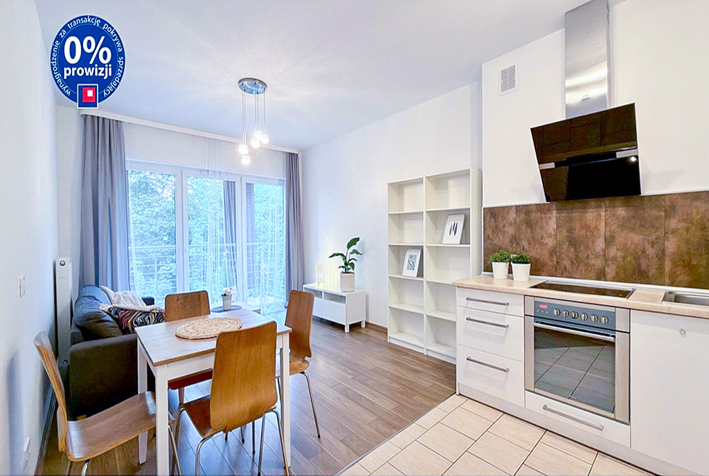 Po lewej jadalnia dalej salon po prawej kuchnia w ekskluzywnym apartamencie do sprzedaży Katowice