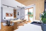 Designerski salon, jadalnia i kuchnia w luksusowym apartamencie na sprzedaż Mielec.