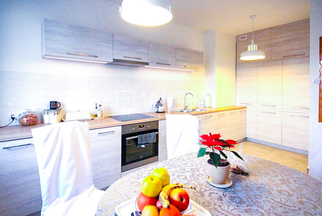 Kompaktowa kuchnia w luksusowym apartamencie do wynajmu Szczecin