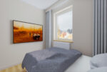 Fragment sypialni w luksusowym apartamencie na sprzedaż Elbląg.